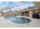 Beautiful pool area featuring a screened enclosure and comfortable patio furniture at 481 W Holly Dr, Orange City, FL 32763