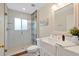 Bright bathroom showcasing a glass enclosed shower, white subway tile, and a farmhouse sink at 483 N Pine Meadow Dr, Debary, FL 32713