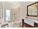 Modern bathroom featuring a glass enclosed shower, stylish vanity with sink, and an exterior entrance at 483 N Pine Meadow Dr, Debary, FL 32713