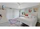Inviting bedroom featuring a cozy queen bed, ceiling fan, and double closets for ample storage at 483 N Pine Meadow Dr, Debary, FL 32713