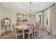 Charming dining room with a traditional table, wood floors, and soft natural lighting at 483 N Pine Meadow Dr, Debary, FL 32713