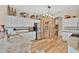 Bright kitchen featuring white cabinets, stainless steel appliances, and unique decorative accents at 483 N Pine Meadow Dr, Debary, FL 32713