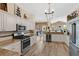 Modern kitchen with granite countertops, stainless steel appliances, and a spacious open design at 483 N Pine Meadow Dr, Debary, FL 32713