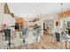 Open kitchen with breakfast bar, white cabinets, and a decorative brick accent wall at 483 N Pine Meadow Dr, Debary, FL 32713