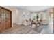Comfortable living room with wood floors, decorative wall accents, and plenty of natural light at 483 N Pine Meadow Dr, Debary, FL 32713