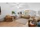 Spacious living room with vaulted ceilings, wood floors, and comfortable seating arrangements at 483 N Pine Meadow Dr, Debary, FL 32713