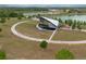 Outdoor amphitheater features a covered stage and waterfront views near walking path at 484 Lanarkshire Pl, Apopka, FL 32712