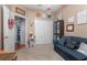 Cozy bedroom featuring a sofa, a built-in cabinet, and neutral carpeting at 484 Lanarkshire Pl, Apopka, FL 32712