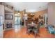 Open-concept dining area featuring a unique blend of flooring, stylish decor, and plenty of natural light at 484 Lanarkshire Pl, Apopka, FL 32712