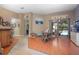 Bright dining area with an adjacent pool view, hardwood floors, and a seamless flow to the outdoor space at 484 Lanarkshire Pl, Apopka, FL 32712