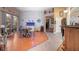 Bright dining area with sliding glass doors to the patio, hardwood flooring, and decorative accents at 484 Lanarkshire Pl, Apopka, FL 32712