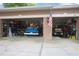 Spacious two-car garage featuring ample storage and a classic truck at 484 Lanarkshire Pl, Apopka, FL 32712