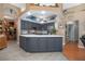 Spacious kitchen boasts stainless steel appliances, a large island, and a view of the open-concept living area at 484 Lanarkshire Pl, Apopka, FL 32712