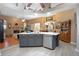 Open-concept kitchen with a large island, stainless steel appliances, and a clear view of the living space at 484 Lanarkshire Pl, Apopka, FL 32712
