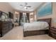 Spacious main bedroom with large windows, ceiling fan, and access to outdoor space at 484 Lanarkshire Pl, Apopka, FL 32712