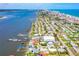 Stunning aerial view of waterfront homes and a vibrant community, highlighting its prime coastal location at 5 Talo Cir, Port Orange, FL 32127