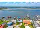 Aerial view of a waterfront neighborhood featuring homes with private docks, lush landscaping, and serene water views at 5 Talo Cir, Port Orange, FL 32127