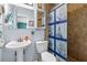 Nautical-themed bathroom featuring a pedestal sink, and tiled shower at 5 Talo Cir, Port Orange, FL 32127