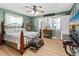 Comfortable bedroom with beach decor, ceiling fan, and plenty of natural light at 5 Talo Cir, Port Orange, FL 32127
