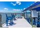 Waterfront home with a covered boat dock featuring comfortable blue chairs and a picnic table at 5 Talo Cir, Port Orange, FL 32127