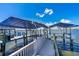 View of boat lift with dock for easy water access and boat storage at 5 Talo Cir, Port Orange, FL 32127