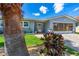 Charming home featuring well-maintained landscaping and a brick-paved driveway at 5 Talo Cir, Port Orange, FL 32127
