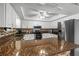 Well-equipped kitchen with modern appliances, granite counters, and tile backsplash at 5 Talo Cir, Port Orange, FL 32127
