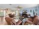Inviting living room featuring tile floors, comfortable seating, and a relaxed atmosphere at 5 Talo Cir, Port Orange, FL 32127