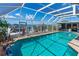 Inviting screened-in pool boasts scenic views and ample space for relaxation and recreation at 5 Talo Cir, Port Orange, FL 32127