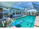 Inviting indoor pool area with sliding glass doors to the outside at 5 Talo Cir, Port Orange, FL 32127