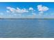 Relaxing water view showcasing the tranquil waters of the area under a clear sky with scattered clouds at 5 Talo Cir, Port Orange, FL 32127
