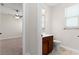 Bright bathroom featuring a wood vanity and a ceramic tile floor at 5064 Meadow Song Dr, Okahumpka, FL 34762