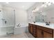 Bathroom features double vanity, soaking tub, and glass enclosed shower at 5064 Meadow Song Dr, Okahumpka, FL 34762