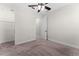 Carpeted bedroom featuring a ceiling fan, closet, and white trim at 5064 Meadow Song Dr, Okahumpka, FL 34762