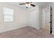 Bright bedroom featuring a window and a closet with sliding doors at 5064 Meadow Song Dr, Okahumpka, FL 34762