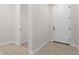 Bright foyer featuring wood-look tile flooring and a white front door at 5064 Meadow Song Dr, Okahumpka, FL 34762