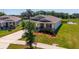 Well maintained single Gathering home with manicured lawn, landscaping, and a large driveway at 5064 Meadow Song Dr, Okahumpka, FL 34762