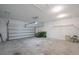 Spacious two-car garage with ample storage space and a clean, uncluttered design at 5064 Meadow Song Dr, Okahumpka, FL 34762