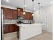Charming kitchen featuring a functional island, stainless appliances, and plenty of cabinet space at 5064 Meadow Song Dr, Okahumpka, FL 34762