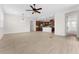 Large living room and open-concept kitchen features modern flooring and ample space at 5064 Meadow Song Dr, Okahumpka, FL 34762