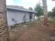 Spacious backyard featuring low maintenance landscaping and the side of the home at 540 W Mathis Ave, Deland, FL 32720
