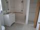 A bathroom with a walk-in shower, grab bar, and a white vanity at 540 W Mathis Ave, Deland, FL 32720