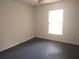 This bedroom offers a window for light and a simple, minimalist design at 540 W Mathis Ave, Deland, FL 32720