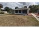 Charming screened-in patio adjacent to the house creates a unique outdoor living space at 540 W Mathis Ave, Deland, FL 32720