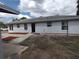 This home shows great curb appeal, with its neutral paint scheme and meticulously landscaped surroundings at 540 W Mathis Ave, Deland, FL 32720