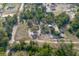 Expansive aerial view of a home nestled amongst lush trees and spacious land at 5410 Deleon Springs Ranch Rd, De Leon Springs, FL 32130