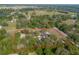 Aerial view of property with property lines, showcasing the home surrounded by dense trees at 5410 Deleon Springs Ranch Rd, De Leon Springs, FL 32130