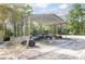 A large carport offers covered parking for vehicles and equipment at 5410 Deleon Springs Ranch Rd, De Leon Springs, FL 32130
