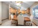 Cozy dining area featuring a wooden table and chairs, adjacent to the kitchen at 5410 Deleon Springs Ranch Rd, De Leon Springs, FL 32130
