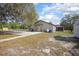 Charming single-story home with a spacious yard and a detached screened-in porch for outdoor enjoyment at 5410 Deleon Springs Ranch Rd, De Leon Springs, FL 32130